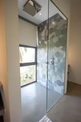 a glass shower in a bathroom with a window at Charmante villa de 4CH avec piscine privée - Proche du Beldi Country Club in Marrakech