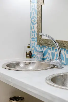 a bathroom counter with two sinks and a mirror at Riad - Jacuzzi & Breakfast , 5min walk Jemaa El Fnaa & Vue Rooftop Médina in Marrakech
