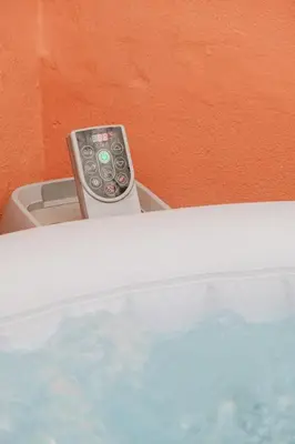 a remote control sitting on top of a washing machine at Riad - Jacuzzi & Breakfast , 5min walk Jemaa El Fnaa & Vue Rooftop Médina in Marrakech