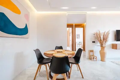 a dining room with a table and chairs at Modern and Cozy Apartment Center of Marrakech in Marrakech