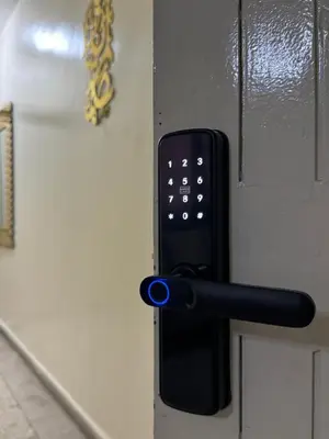a door with a black door handle on a door at Only 5-minutes walk to airport, your perfect choice for an early or late flight in Oulad Akkou