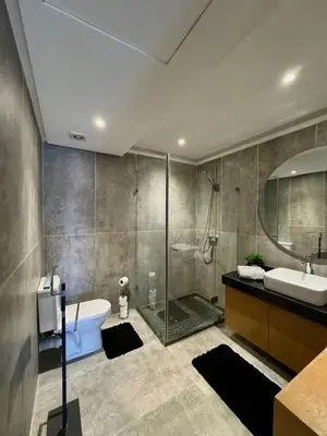 a bathroom with a tub and a sink and a shower at Lovely 2 bedroom apartment in Marrakech