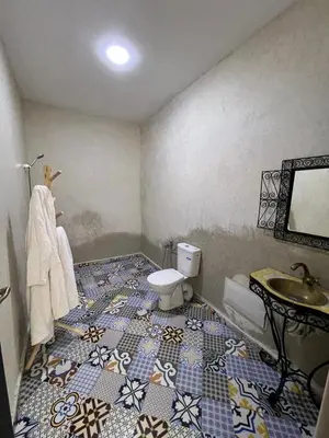 a bathroom with a sink and a toilet at Villa familiale, piscine privée sans vis-à-vis in Marrakech