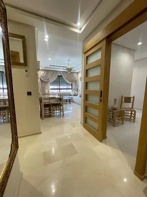 a hallway with a door and a dining room at Apartment for rent in Marrakech