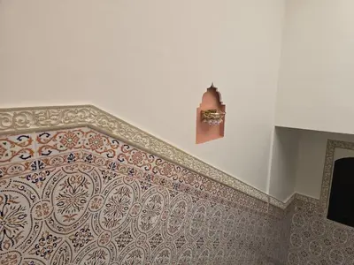 a corner of a room with a wall with a wall at Riad Zaitone 146 in Marrakech