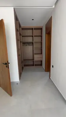 an empty room with a closet with wooden shelves at Villa Selma in Marrakech