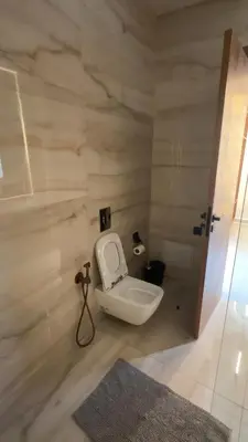 a bathroom with a white toilet in a room at Villa Selma in Marrakech