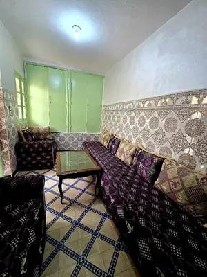 a living room with a couch and a table at light stay in Marrakech