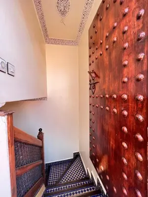 a room with a wooden door and stairs at Riad-style villa with a private pool in Marrakech