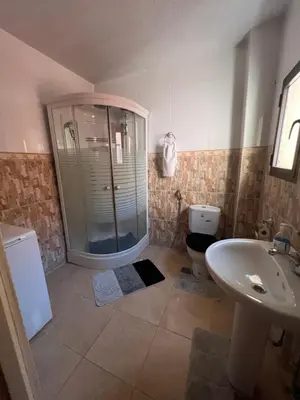 a bathroom with a shower and a toilet and a sink at Marrakech gulize in Marrakech
