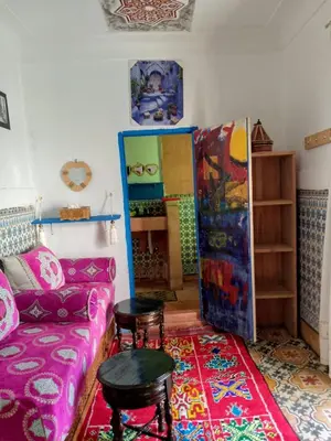 a living room with a couch and a table at Riad Dar Medina Land in Marrakech