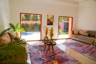a living room with a couch and a table in a room at Marrakesh villa 1 in Marrakech