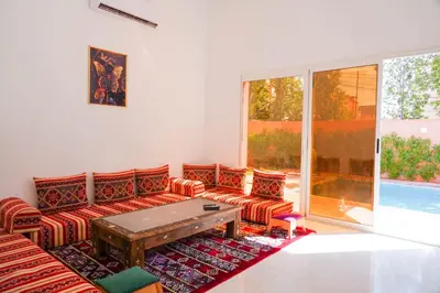 a living room with two couches and a table at Marrakesh villa 1 in Marrakech