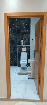 a bathroom with a toilet in a room at Dar lala soukaina in Marrakech