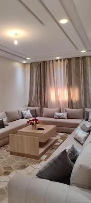 a living room with couches and a coffee table at Dar lala soukaina in Marrakech
