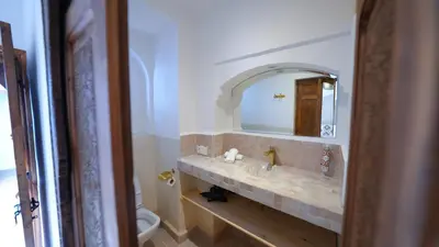 a bathroom with a sink and a mirror at Riad 2 Ksour Marrakesh in Marrakech