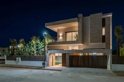 a house with a night view of it at Villa Bahia Luxury-Pool Breakfast & Golf Access in Marrakech