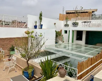 a building with a glass roof with plants on it at Riad zouine dans un quartier traditionnel in Marrakech