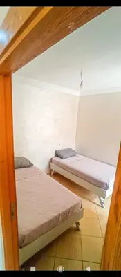 a room with two bunk beds in it at Appartement DUPLEX in Marrakech