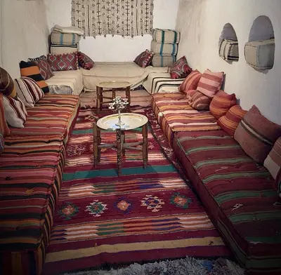 a living room with two couches and a table at Farm stay in Marrakech