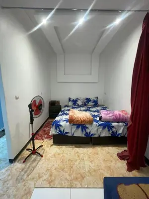 a bedroom with a bed and a camera in it at Suite 2 in Marrakech