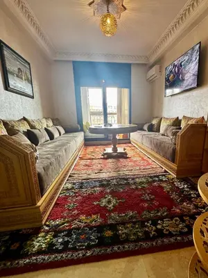a living room with a couch and a table at Luxury Gueliz Apartment-Miramas 2 in Marrakech