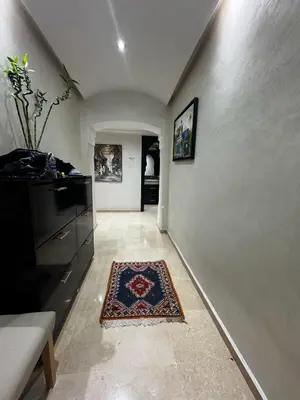 a hallway of a home with a rug on the floor at Luxury Gueliz Apartment-Miramas 2 in Marrakech