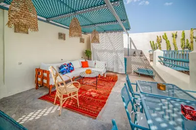 a living room with a couch and a table at Riad Dar Palma Heated Pool Jacuzzi Heart Of Marrakech Medina in Marrakech