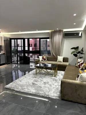a living room with a couch and a coffee table at Chic Duplex Central 3 Suites et Wi-Fi in Marrakech