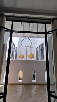 a room with two baskets hanging from the ceiling at Riad Daba Chic in Marrakech