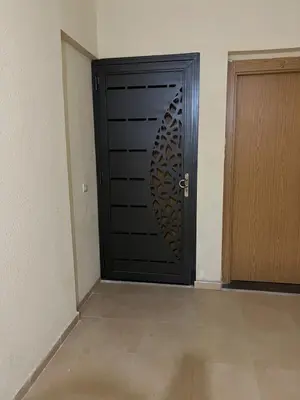 a black door with a circular design on it at Brand new cozy apartment in Marrakech