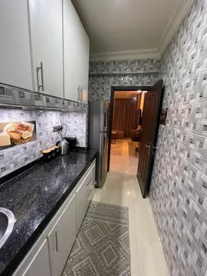 a kitchen with a sink and a counter top at Luxurious and charming apartment in Marrakech