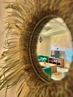a living room with a couch and a table at Marrakech home in Marrakech