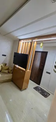 a living room with a flat screen tv in a box at Great modern holiday apartment Marrakesh in Marrakech