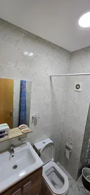 a bathroom with a toilet and a sink at Great modern holiday apartment Marrakesh in Marrakech