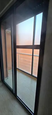 a sliding glass door in a room with a window at Great modern holiday apartment Marrakesh in Marrakech