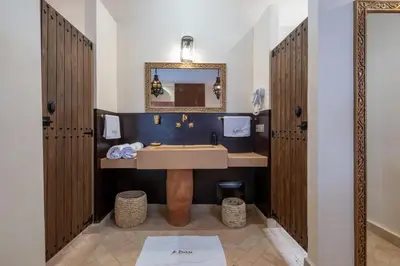a bathroom with a sink and a mirror at Al destino Resort Marrakech in Marrakech