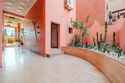 an empty hallway of a house with plants at Duplex Style and Confortable au Centre de la Ville in Marrakech