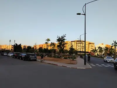 a street with cars parked on the side of a road at Home sweet home in Marrakech in Marrakech