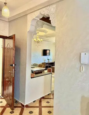 a hallway of a living room with a dining room at Marakech home in Marrakech