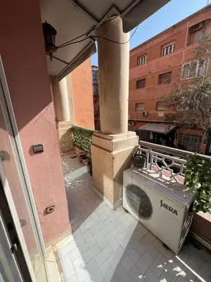 an outside view of a building with a dishwasher at Cozy appartement en plein coeur de Guéliz in Marrakech