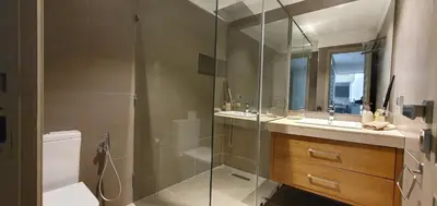 a bathroom with a shower and a toilet and a sink at APPART GUELIZ PLAZA MARRAKECh in Marrakech