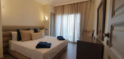 a bedroom with a large bed with blue towels on it at APPART GUELIZ PLAZA MARRAKECh in Marrakech