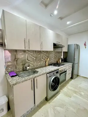 a kitchen with a sink and a washing machine at Opera 160&165 in Marrakech