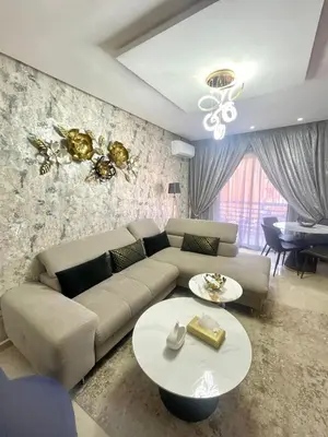 a living room with a couch and a table at Opera 160&165 in Marrakech