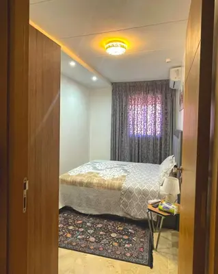 a bedroom with a bed and a window at Opera 160&165 in Marrakech