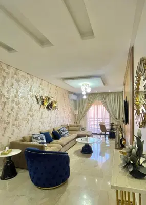 a living room with a couch and a table at Opera 160&165 in Marrakech