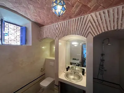a bathroom with a sink and a toilet at Villa Grenade in Marrakech