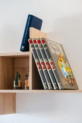 a stack of dvds sitting on top of a shelf at 3 Bedroom Apartment with Pool View Prestigia in Marrakech