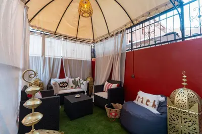 a room with a tent with chairs and a table at Gueliz family Express in Marrakech